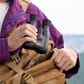 4549292148299_Rel AnyConv.com__canon-10x20-is-binoculars-man-holding-binoculars-about-to-put-them-in-a-shoulder-bag.jpg
